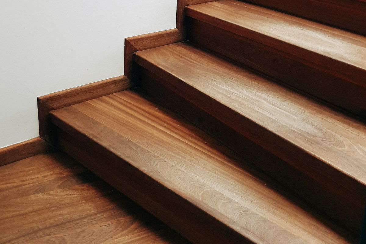 Close-up of warm hardwood stair treads with rounded nosings