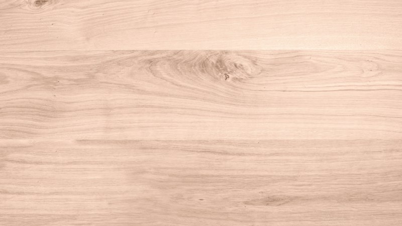 Close-up of smooth light oak plank flooring with a clear, even finish